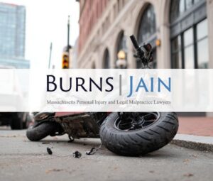 scooter moped on its side on the pavement after a crash in boston massachusetts